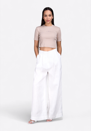 Model wearing EAST VIBE signature crop top, full front view – East Vibe